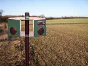 Bird scarer 360 mounted on a pole in a field