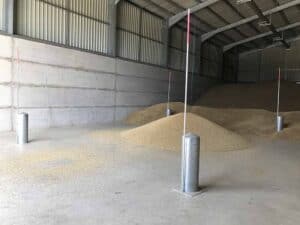 Martin Lishman FloorVent pedestals in a grainstore being loaded by a conveyor system