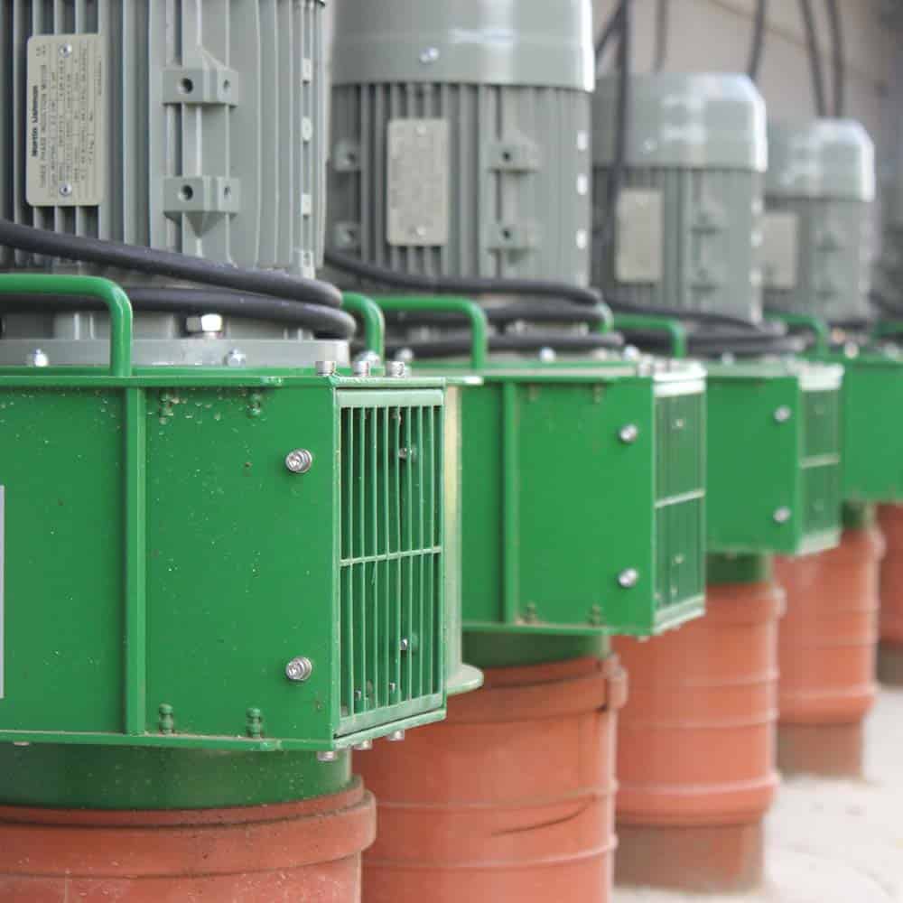 Martin Lishman Grain Pedestal Fans outside a grain store