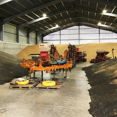 Agricultural machinery in a multi-purpose grains store.